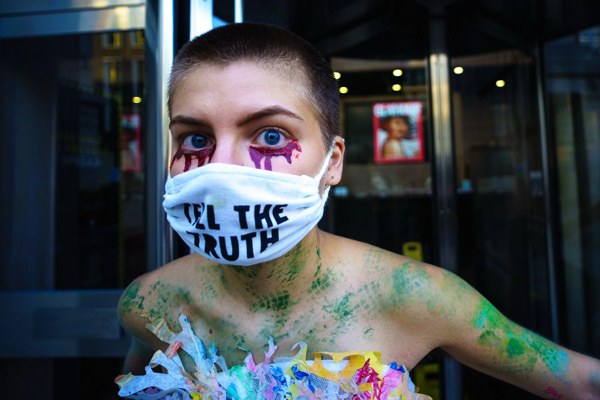An Extinction Rebellion activist glued herself at the entrance of the Vogue Building in London, 2020 - Luv - Vincenzo Lullo | Documentary Photography