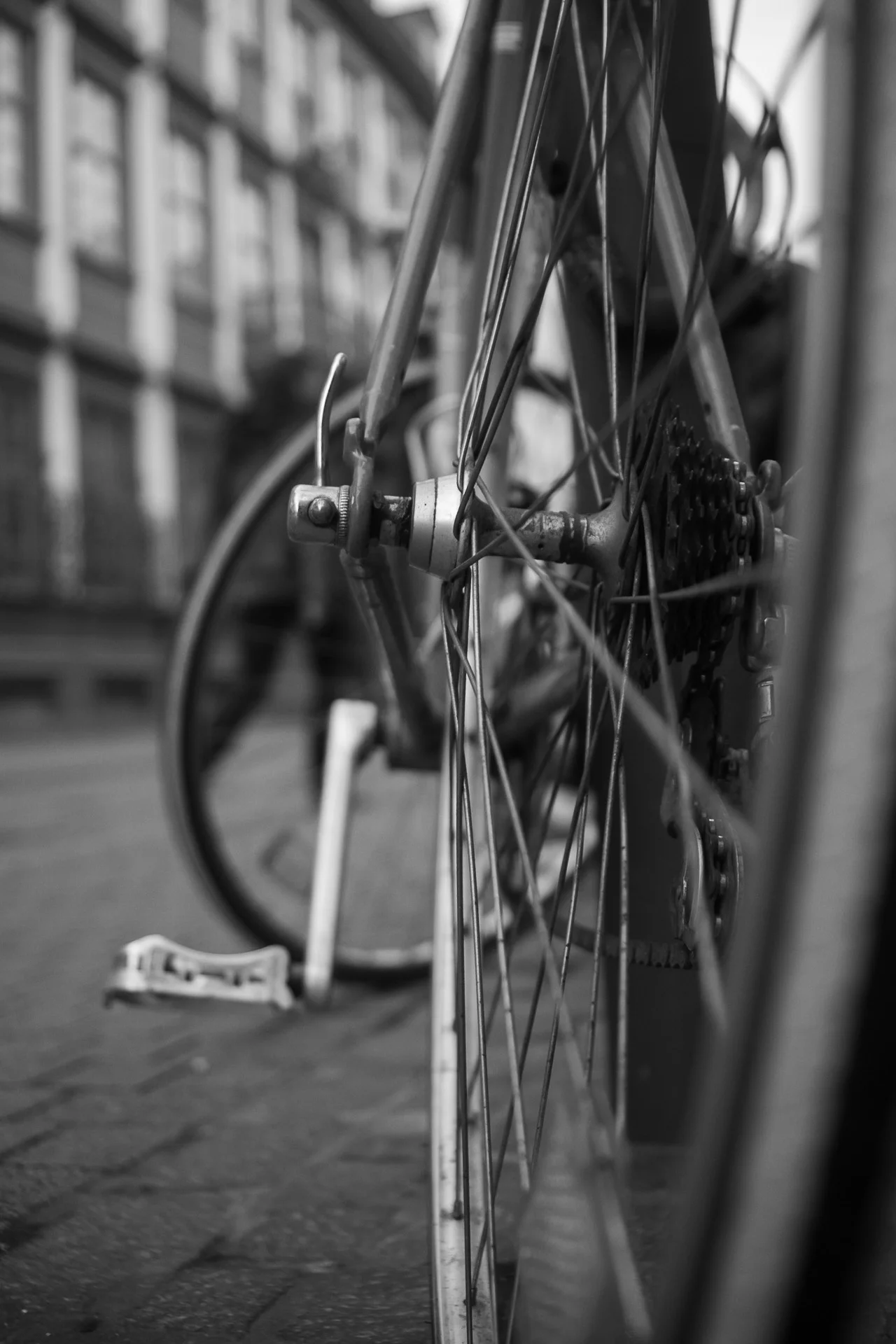 Black-and-white close-up of bicycle cassette gears, revealing concentric rings and shadowed teeth. | Leica SL | N/A | f2.8 | 1/160s | ISO 100