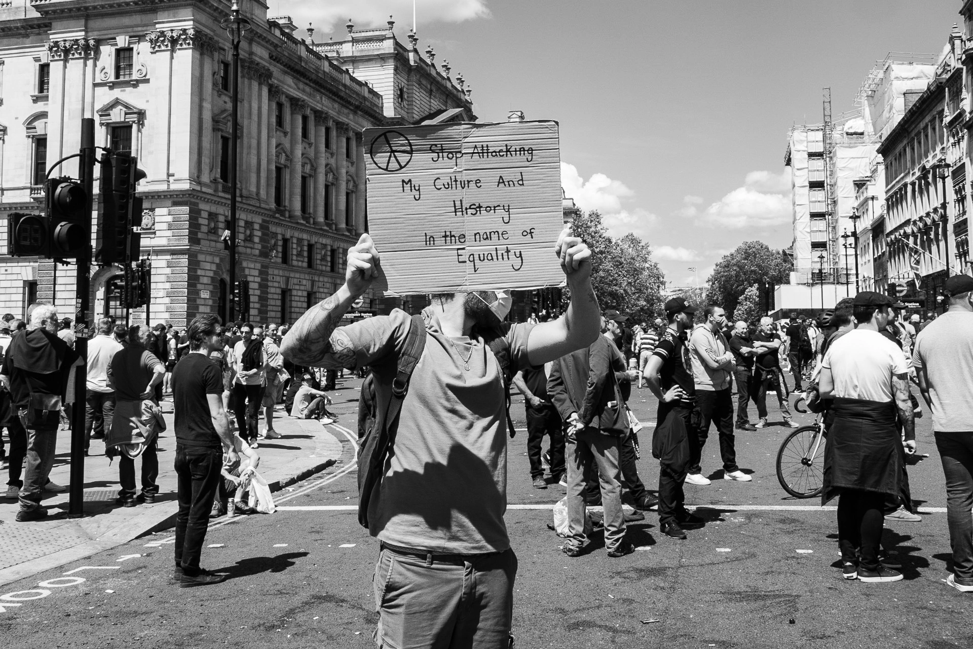 Far Right protester shows a sign in Parliament Sq - Photo documentary | Leica V-Lux | 30mm f/8.0 | 1/250s | ISO 125